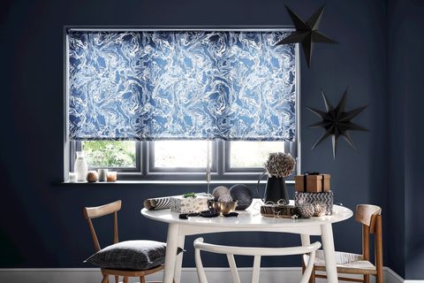 blue marble patterned roller blind on dark living room with minimalist christmas decorations