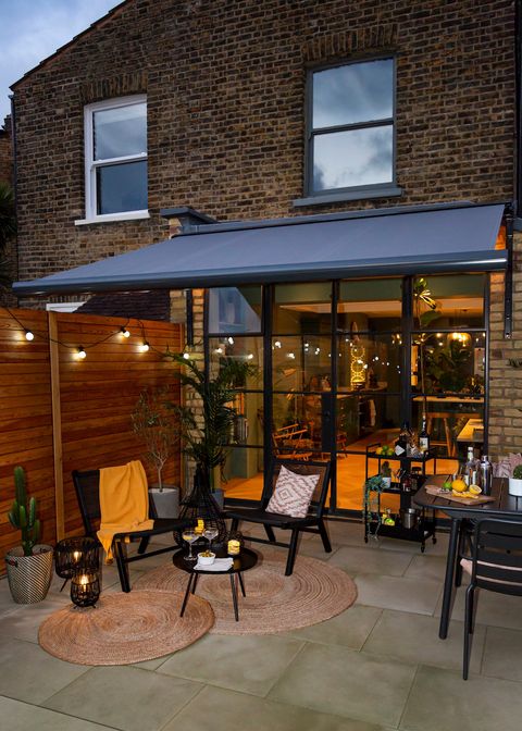 awning open over outdoor entertaining area in winter evening