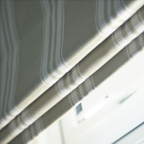 close up of cream and white striped roman blinds