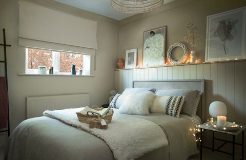 cream coloured roman blind in cosy christmassy bedroom