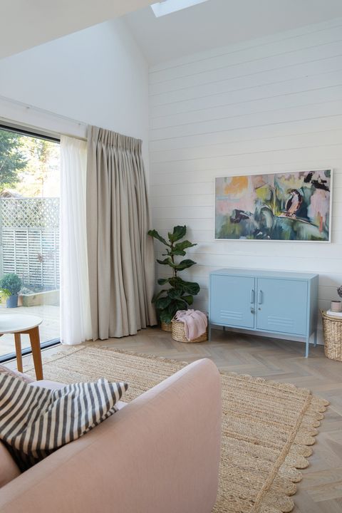 kendra-linen-pencil-pleat-curtains-over-bi-fold-doors-in-a-living-room