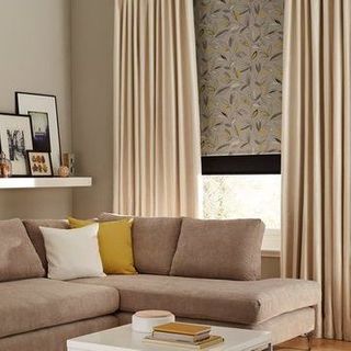 Curtains in Daze Ivory fabric paired with Roller Blinds in Joya Yellow in Living Room Window