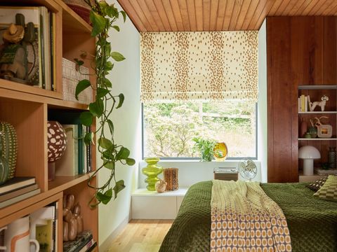 Hillarys Poodle & Blonde Roman Blind in Tottenham Dalmation covering a large window in the living room 