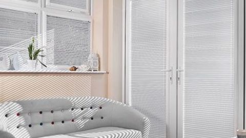 Light Sheer Luxury Pinstripe Venetian blinds hanging in patio doors