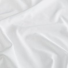 White coloured fabric swirled on a surface